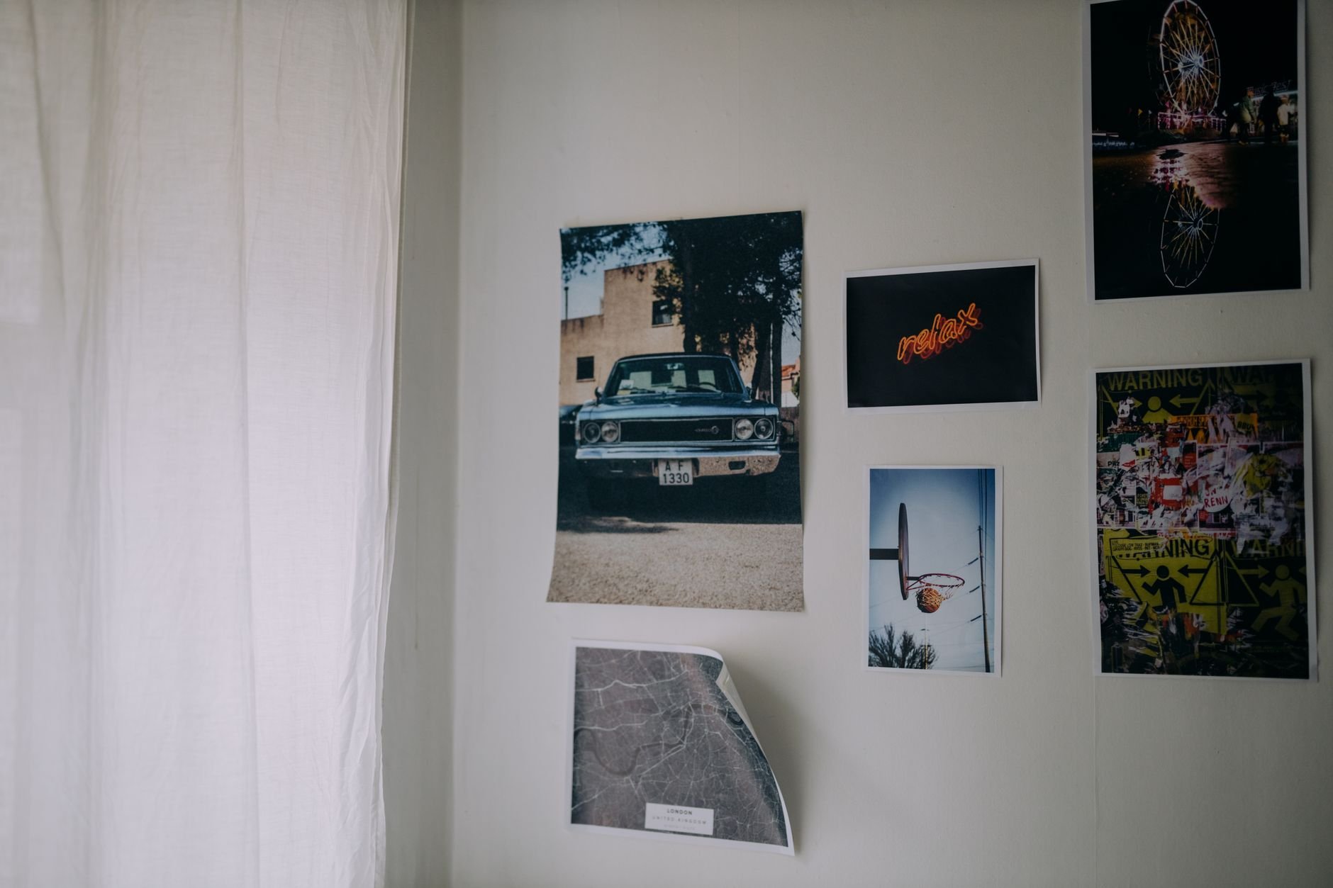 Poster collection displayed on a wall creating an artistic gallery ambiance